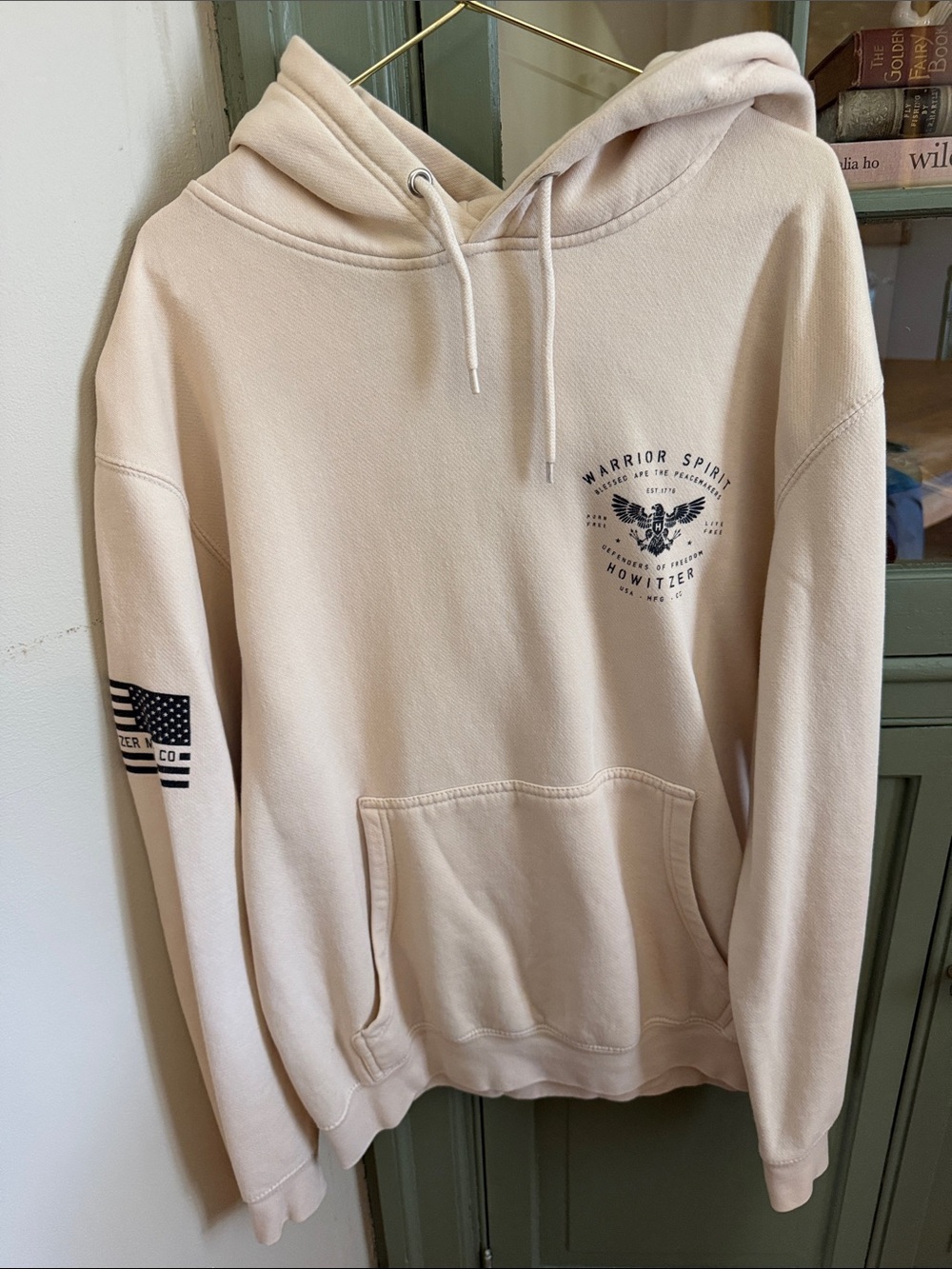 Warrior Spirit Cream Pullover Hoodie with Subtle Chest Graphic